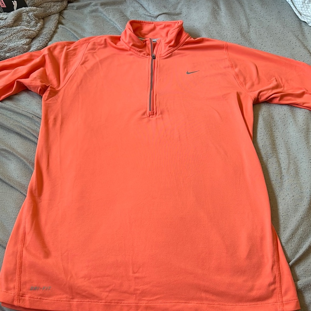 Orange Nike zip up